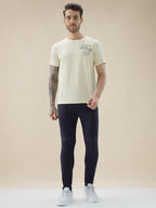Mens Solid Slim Fit Trackpant with Side Zipper Pockets Drawstring and Knee Print Detail