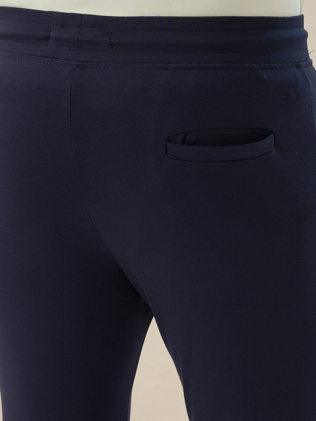 Mens Solid Slim Fit Trackpant with Side Zipper Pockets Drawstring and Knee Print Detail
