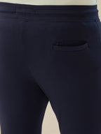 Mens Solid Slim Fit Trackpant with Side Zipper Pockets Drawstring and Knee Print Detail
